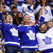 a crowd of Toronto Maple Leaf fans celebrate in the stands of the Scotiabank Centre
